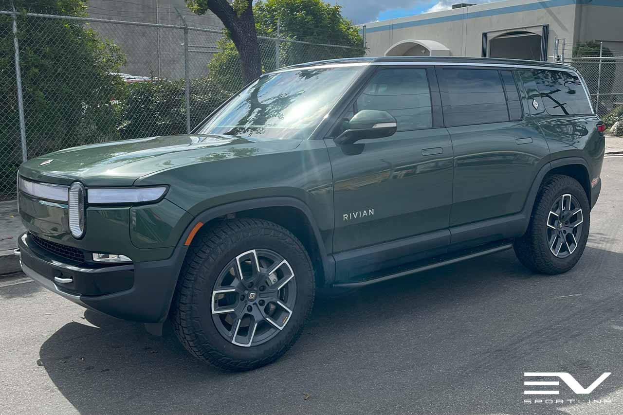 Forest Green Rivian R1S with Triple Square Rock Sliders