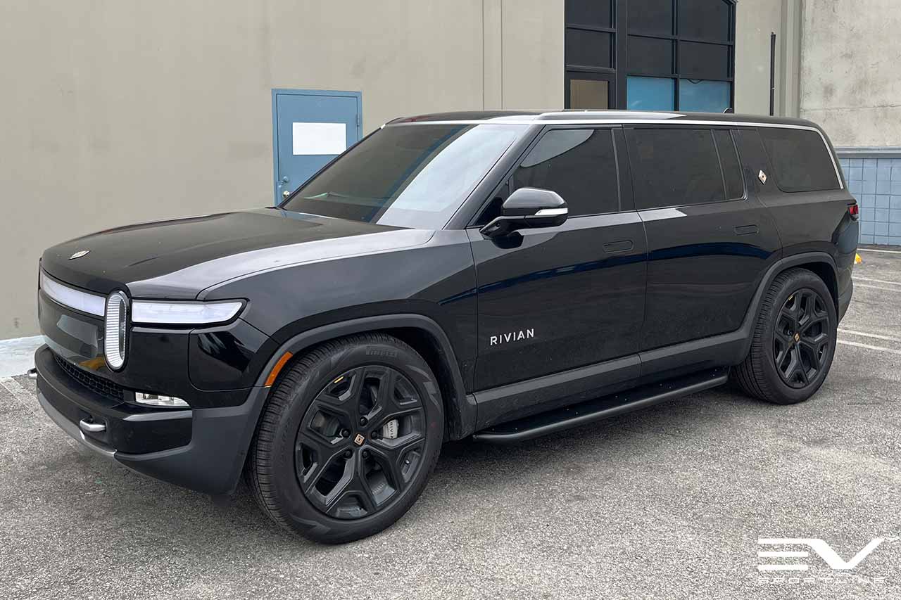 Black Rivian R1S with Triple Square Running Boards