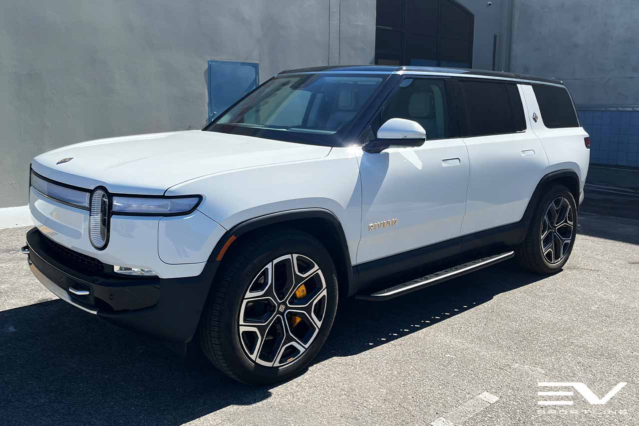 Glacier White Rivian R1S with Triple Slot Running Boards