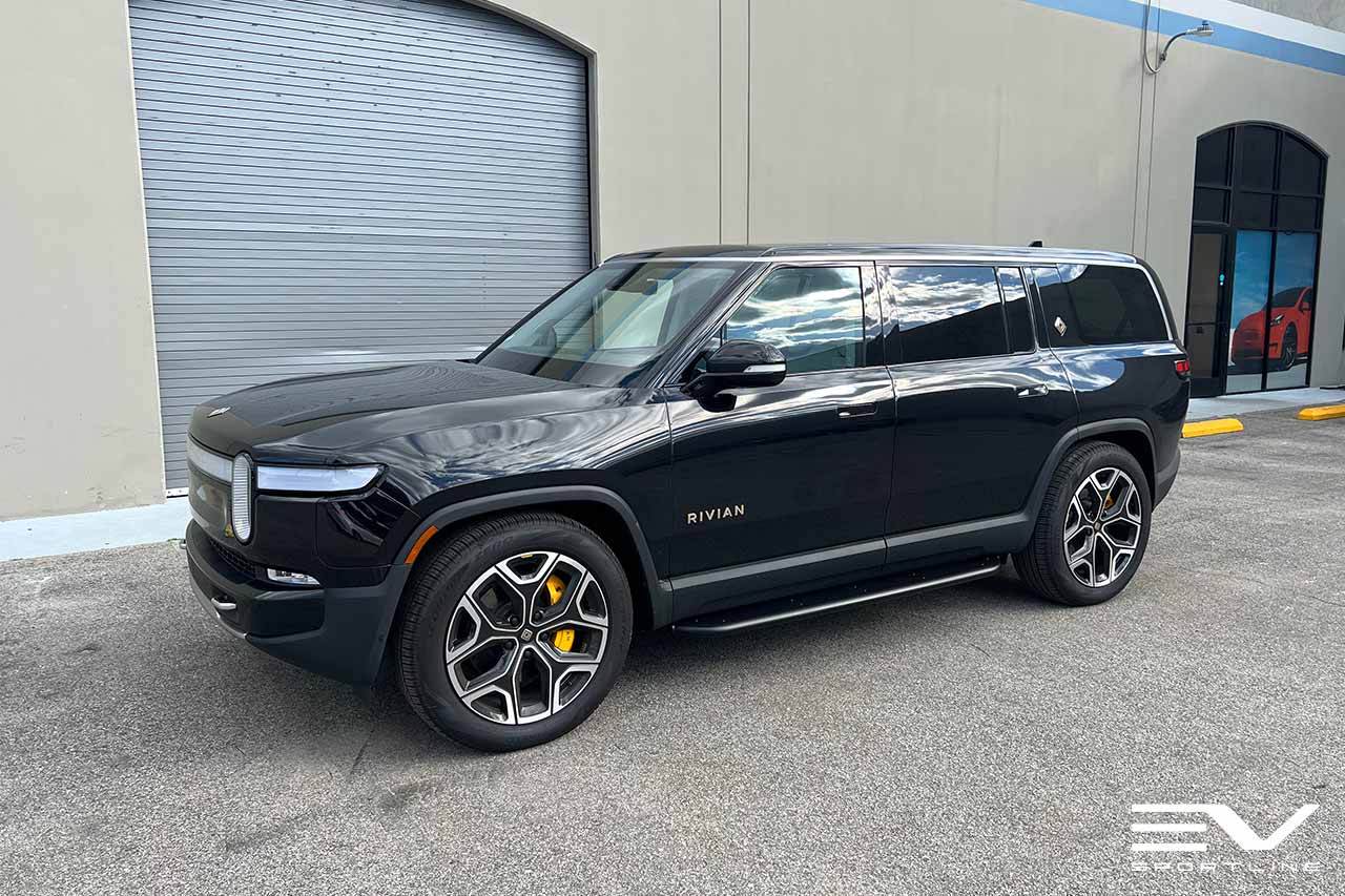 Black Rivian R1S with Triple Square Running Boards