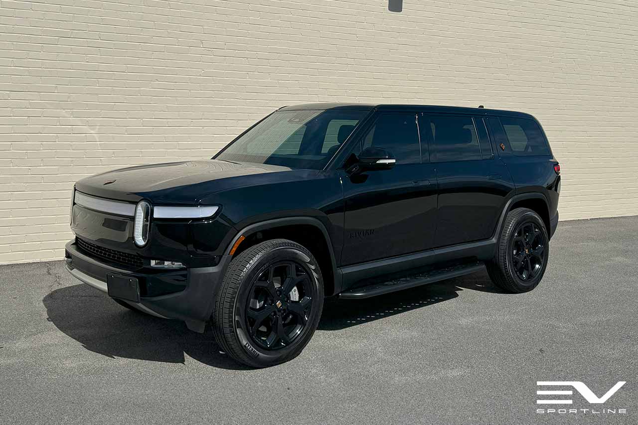 Black Rivian R1S with Triple Slot Running Boards