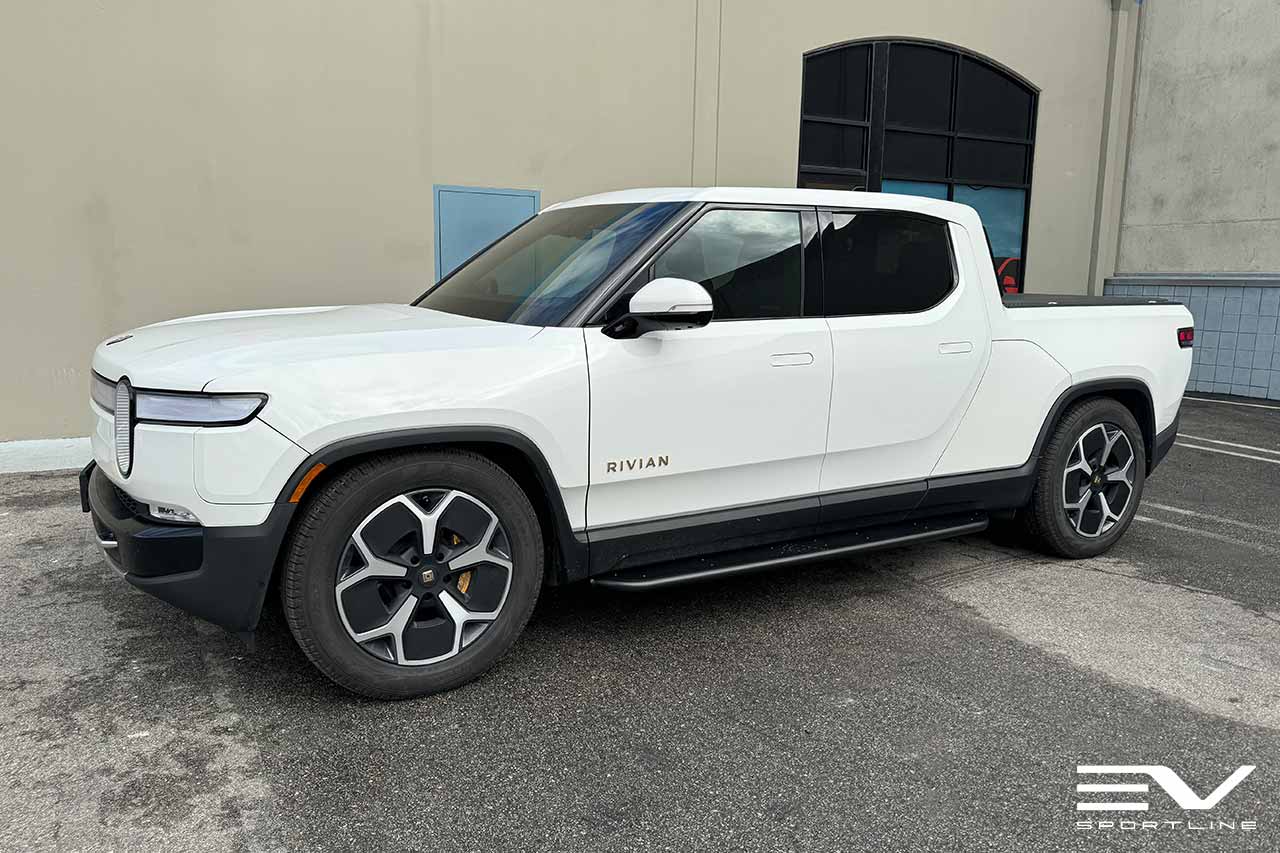 Glacier White Rivian R1T with Triple Square Running Boards