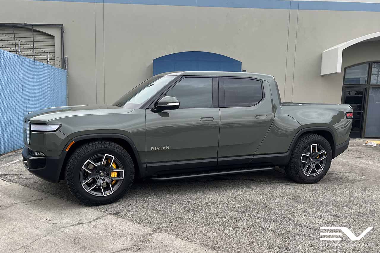 Launch Green Rivian R1T with Triple Slot Rock Sliders