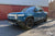 Rivian Blue Rivian R1S with Triple Square Rocksliders