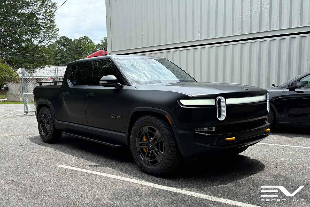 Black Rivian R1T with Triple Square Rock Sliders - EV Sportline - The ...