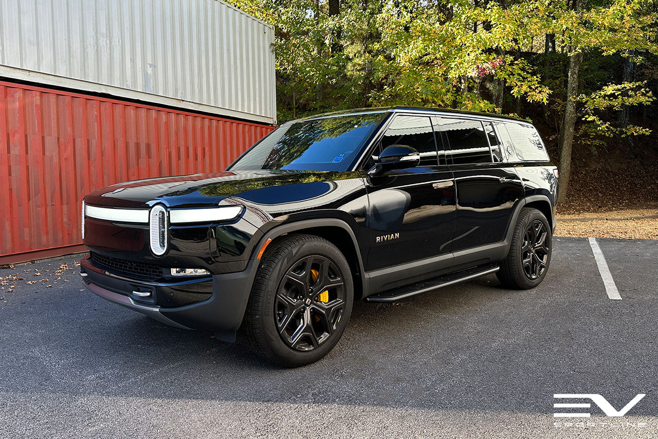Black Rivian R1S with Triple Square Running Boards