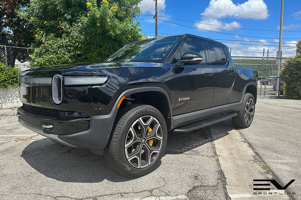 Black Rivian R1T with Triple Slot Running Boards - EV Sportline - The ...