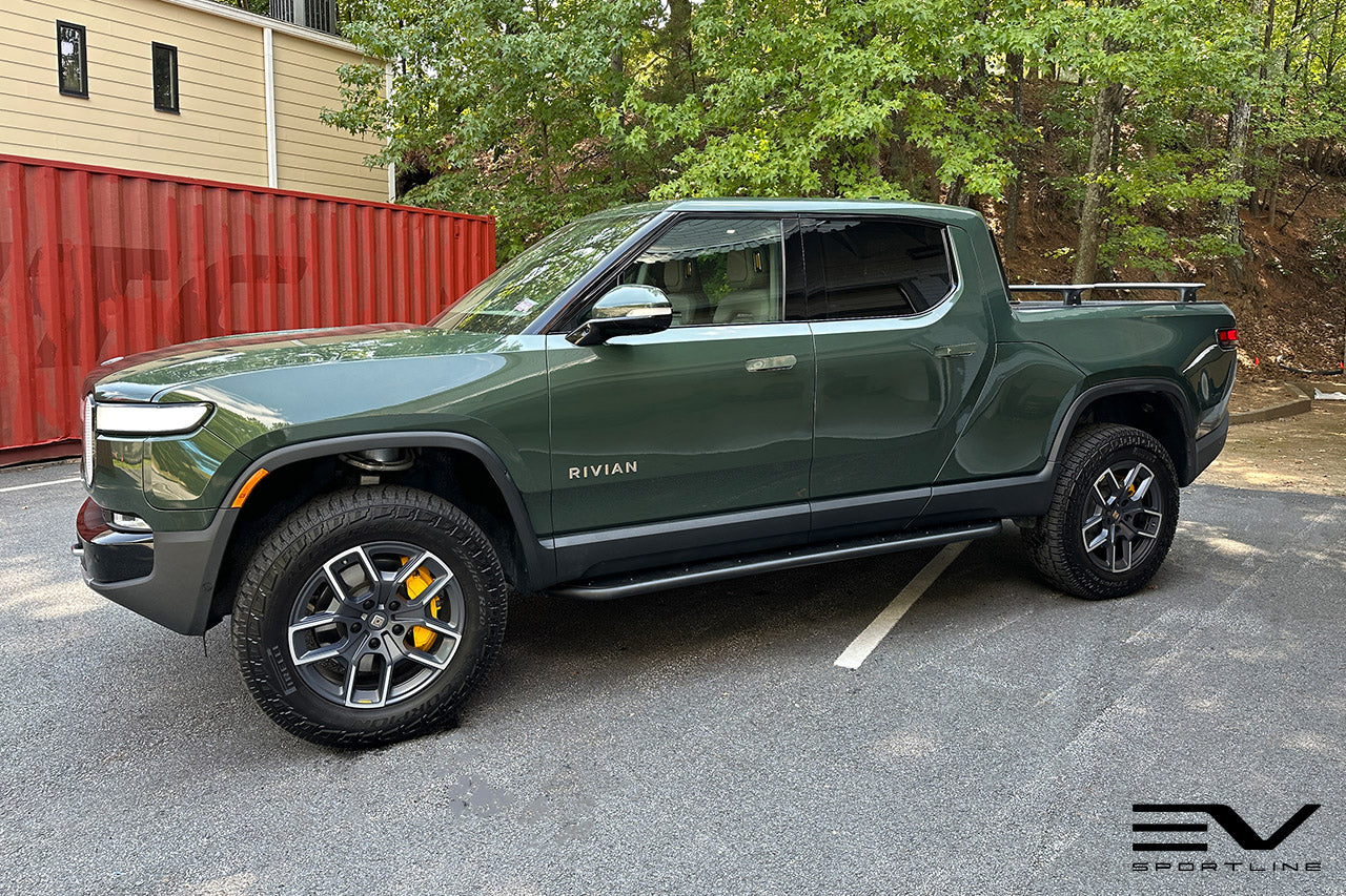 Forest Green Rivian R1T with Triple Square Rock Sliders