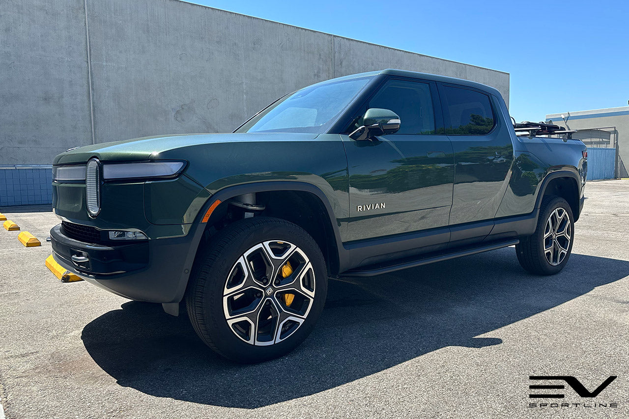 Forest Green Rivian R1T with Triple Square Rock Sliders by Team 1EV