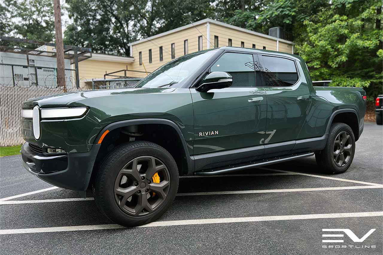 Forest Green Rivian R1T with Triple Slot Thread Running Boards
