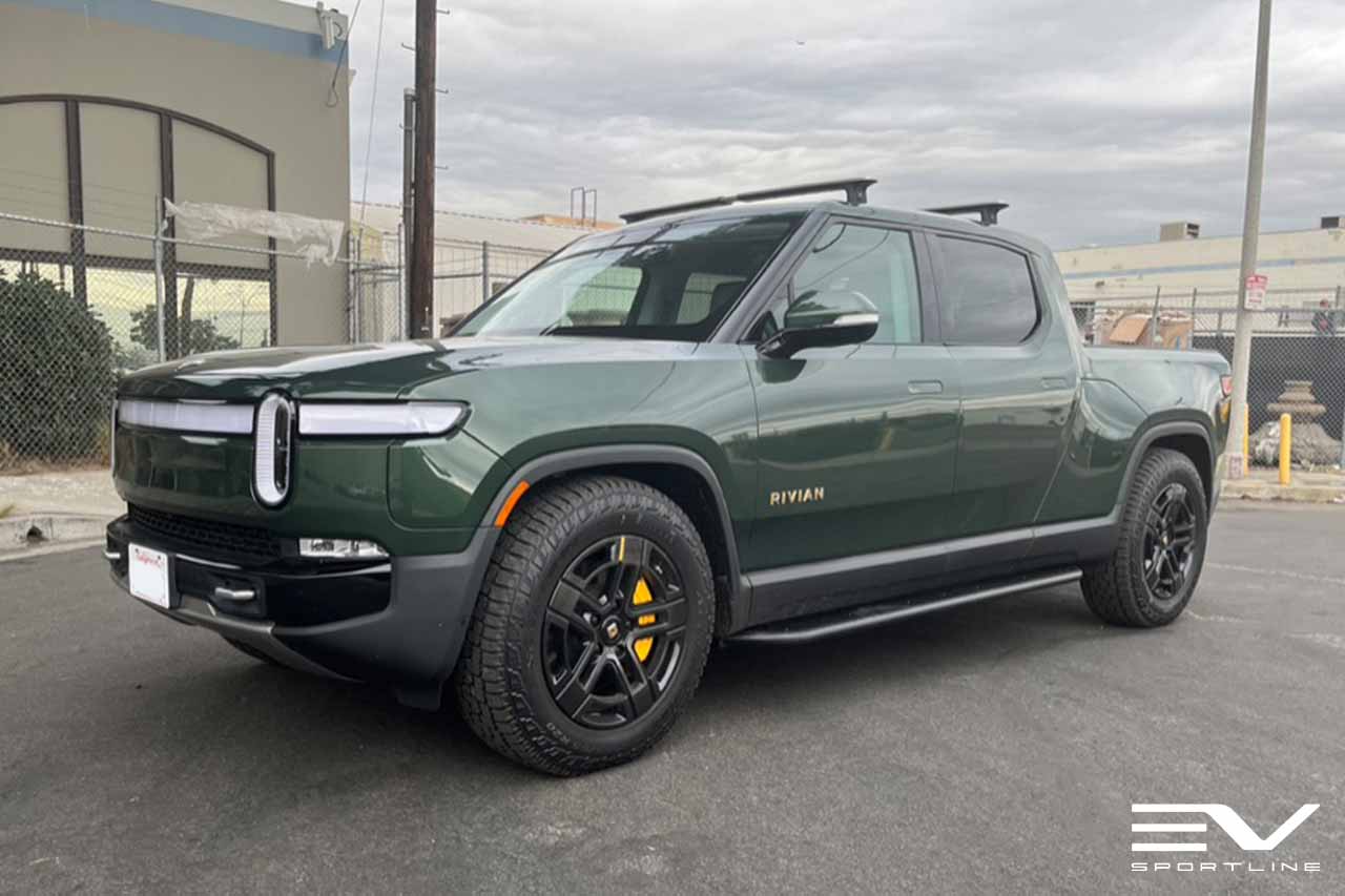 Forest Green Rivian R1T with Triple Square Rock Sliders