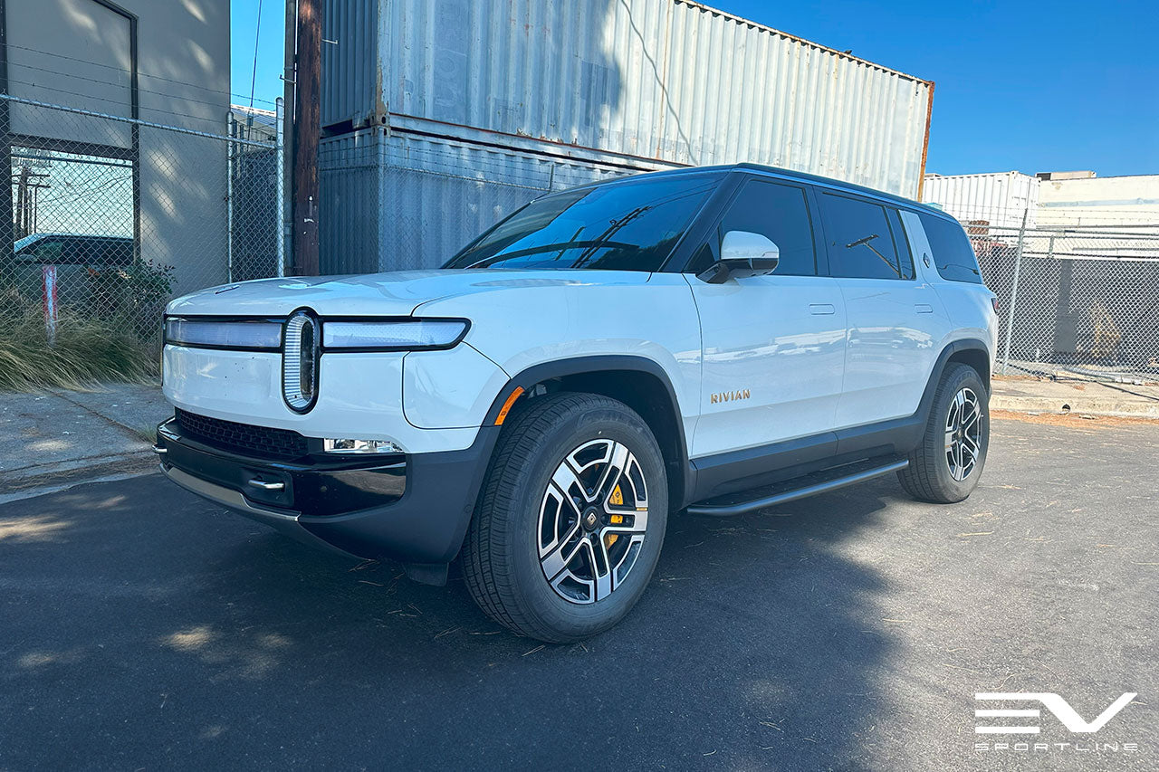 Glacier White Rivian R1S with Triple Slot Running Boards