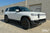 Glacier White Rivian R1S with Triple Slot Running Boards and 20" R1000