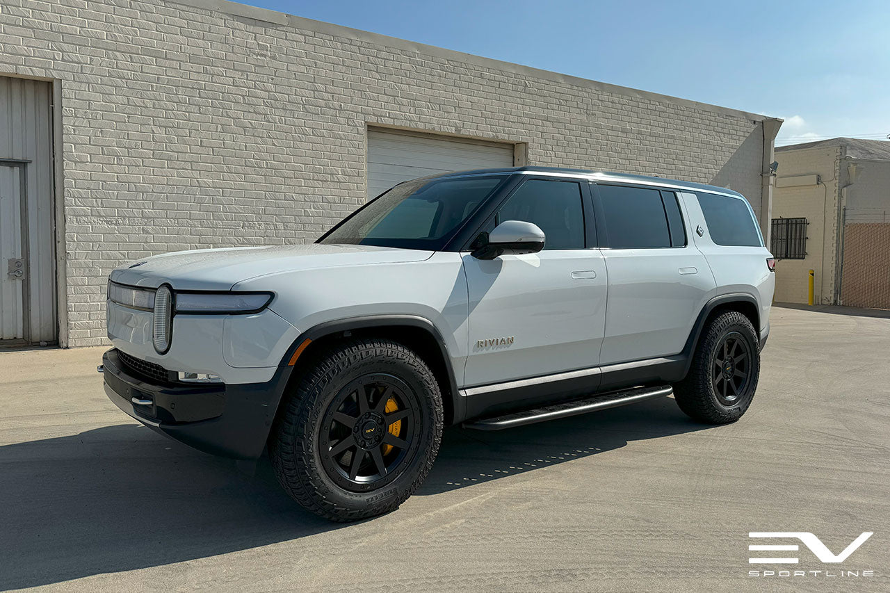Glacier White Rivian R1S with Triple Slot Running Boards and 20" R800
