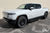 Glacier White Rivian R1T with Triple Slot Running Boards