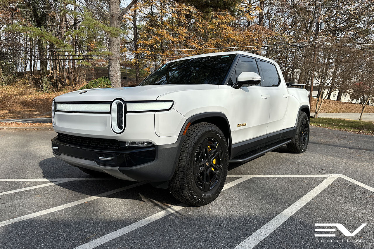 Glacier White Rivian R1T with Triple Square Rock Sliders