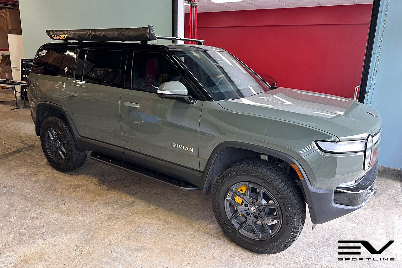 Launch Green Rivian R1S with Triple Square Rock Sliders