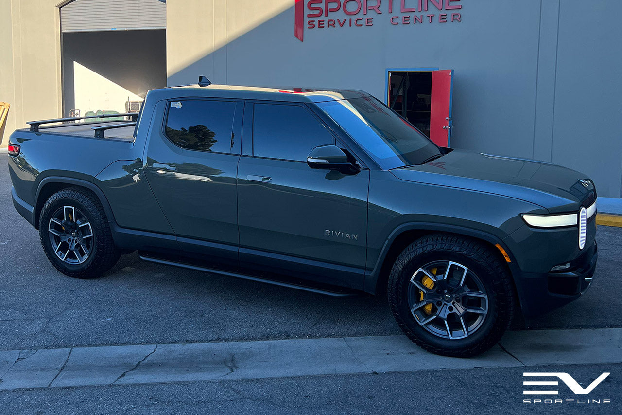 Launch Green Rivian R1T with Triple Square Rock Sliders by Team 1EV