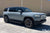 Limestone Rivian R1S with Triple Square Thread Running Boards